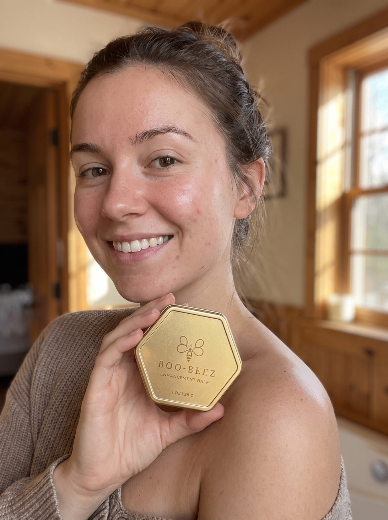 Margaret Whitlock, verified Boo-Beez customer, holding Enhancement Balm